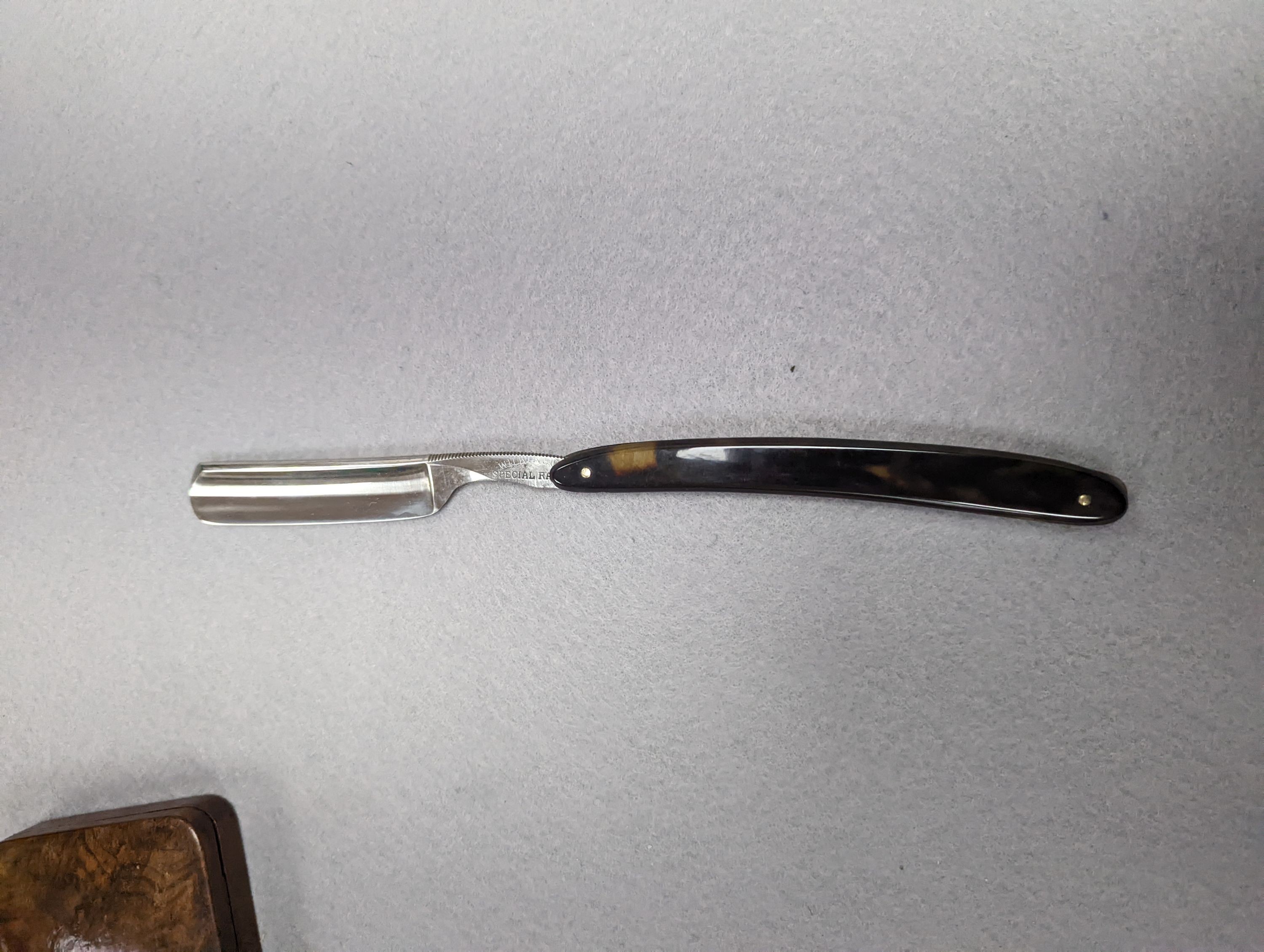 A set of seven tortoiseshell handled cut throat razors for the days of the week Wilkinson and a cased pair of tortoiseshell handled razors, C&W Higginbottom